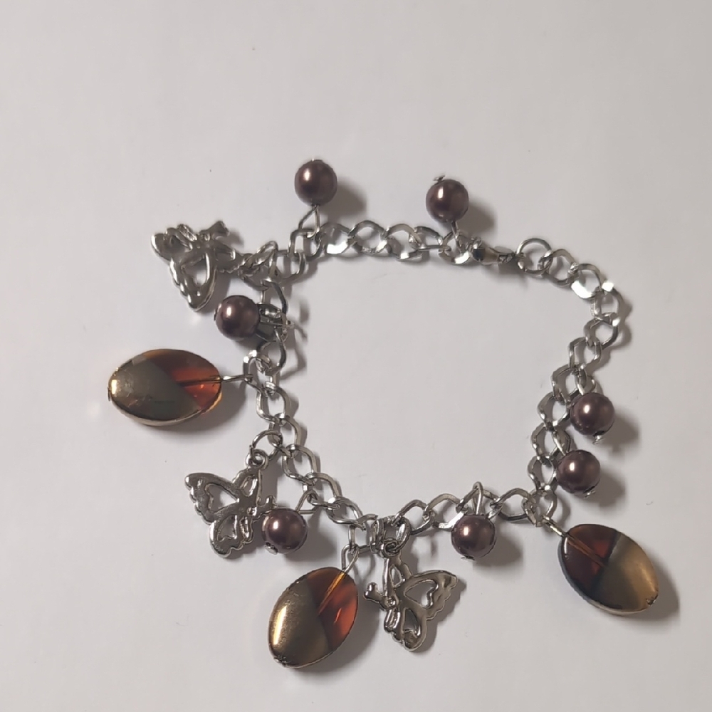 Eclectic Silver and Brown Charm Bracelet with Bitterfly‎ and Oval Charms